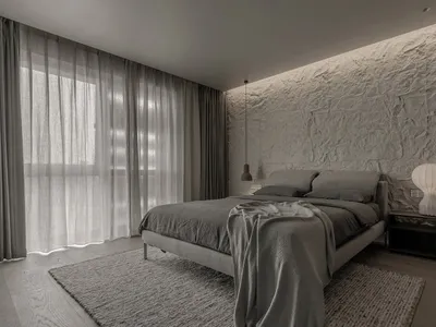 Minimalist bedroom featuring a bed with a fabric texture on a grey background.