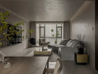 Modern minimalist living room featuring neutral concrete textures and a comfortable sofa.