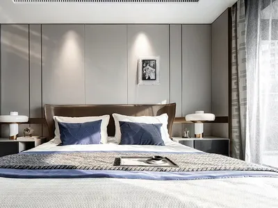 An elegant, minimalist bedroom with a white bed, grey paneling, and a mix of white and grey decorative elements.