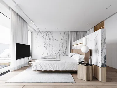 Modern bedroom featuring marble walls and a sleek bed.