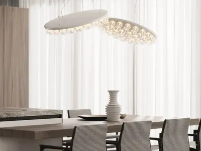 Modern kitchen featuring marble countertops and wooden cabinets and dining table