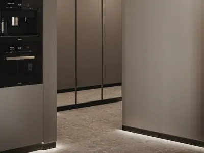 Modern metallic kitchen with sleek, minimalist design.