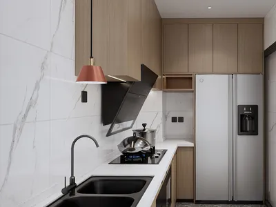Modern kitchen with marble countertops and stainless steel appliances.