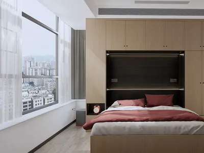 A minimalist bedroom with a bed, red bedding, and white curtains.