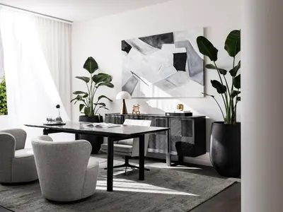 A modern home office with a sleek, black desk, grey upholstered chairs, and a large abstract painting on the wall.