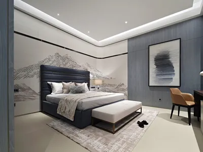 簡約臥室內擺放灰色布面床架，搭配白色床品，牆上懸掛現代藝術作品。