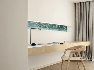 A modern home office with a floating desk made of light-colored wood, a minimalist design, and a small window with greenery o