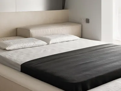 Modern minimalist bedroom with neutral color palette and simple design elements.