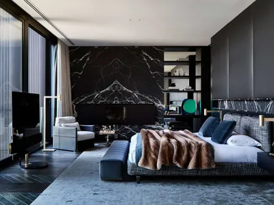 A contemporary bedroom featuring dark wood and marble materials.