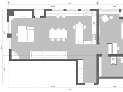 A minimalist living room and kitchen with neutral colors and neutral tiles.