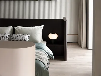 Modern minimalist bedroom with gray metallic and wooden accents.