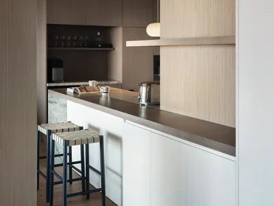Modern kitchen featuring wooden countertops and cabinets.