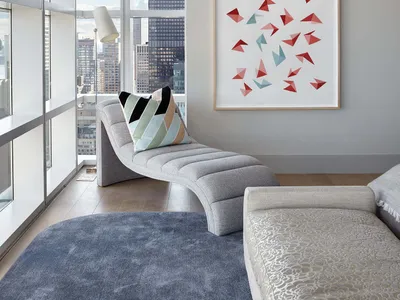 Modern home decor featuring a stylish and comfortable bedroom with fabric and metal elements.