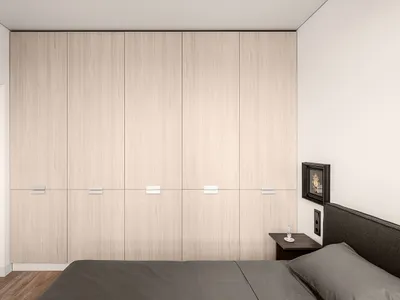 A minimalist bedroom featuring light-colored wooden flooring and furniture against white walls, showcasing a clean and organi