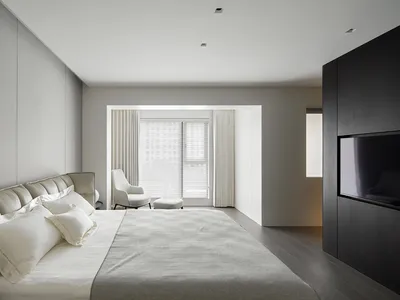 A modern neutral-themed bedroom with minimalist decor and a sleek, contemporary design.