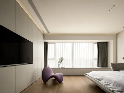 A minimalistic bedroom with light wood flooring, a modern light purple armchair, and a large window with sheer curtains.