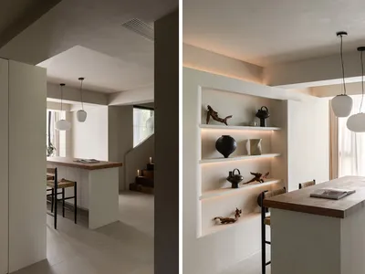 Modern minimalist residential kitchen with concrete surfaces and minimalist design elements.
