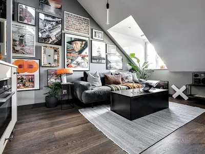 Industrial living room with metal furniture, wooden flooring, and fabric accents