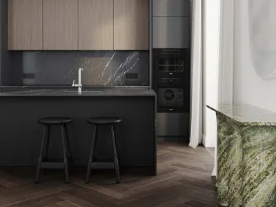 Modern kitchen with wooden cabinets, marble countertops, and stainless steel appliances.