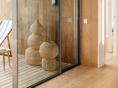 A casual living room featuring wooden materials and decor.