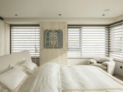 Modern white minimalist bedroom interior with white furniture, clean lines, and a modern design