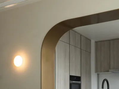 Modern kitchen with marble countertops and wooden cabinets