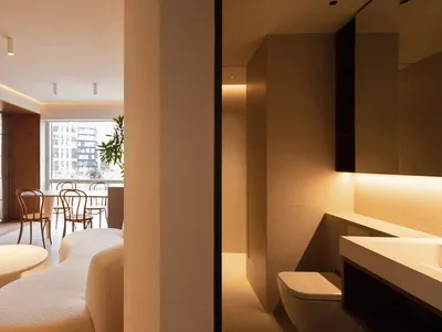 A modern living room featuring industrial design elements with metal furniture and a minimalist aesthetic.