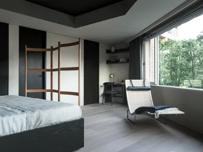 A minimalist bedroom featuring hardwood furniture and a large window with greenery outside.