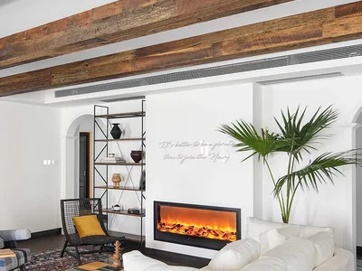 Industrially designed living room featuring wooden beams, concrete floor, and metal accents.
