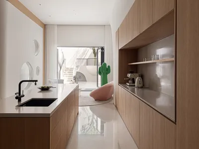 Modern kitchen featuring wooden cabinets, sleek countertops, and a black faucet.