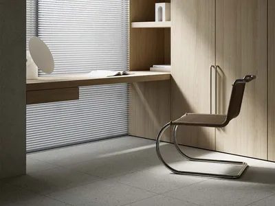 A modern home office featuring wooden cabinets and good lighting.