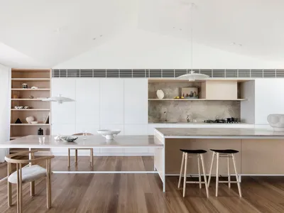 A modern kitchen with wooden and concrete surfaces.