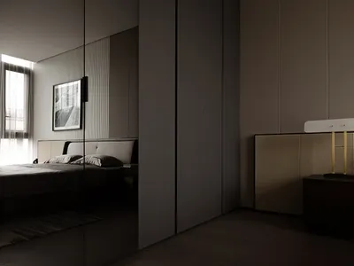 Modern, minimalist bedroom with neutral colors and a large window.