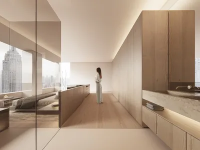 A minimalist bedroom featuring wooden cabinets and flooring, overlooking a cityscape.