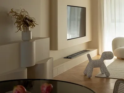 A minimalist living room with modern materials and a sleek, contemporary design.
