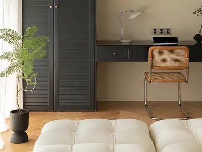 A modern home office space featuring black, gray, and dark wooden elements with a minimalist design.