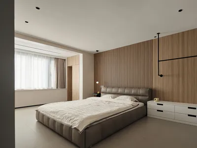 A minimalist bedroom with a wooden accent wall and a bed with a padded headboard.