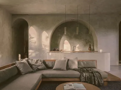 A minimalist living room with concrete walls and furniture, featuring an open space layout.