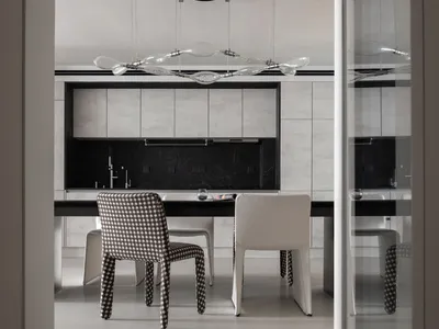 A contemporary kitchen featuring minimalist design with concrete and glass materials.