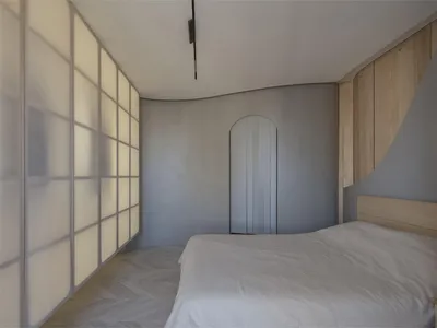 Modern minimalist bedroom featuring a large bed with white bedding, white wood walls, and a large window with frosted glass p