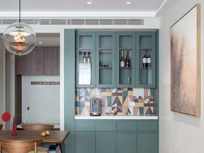 Modern kitchen with wood, concrete, and tile elements.