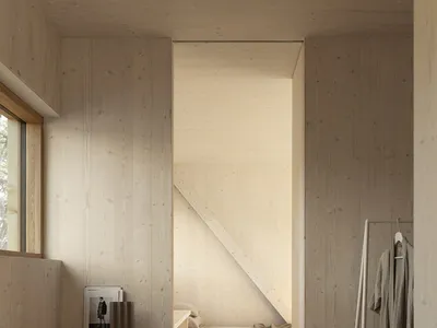 A minimalist bedroom with wooden furniture and a neutral color palette.