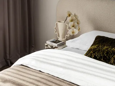 Beige upholstered headboard in a minimalist bedroom