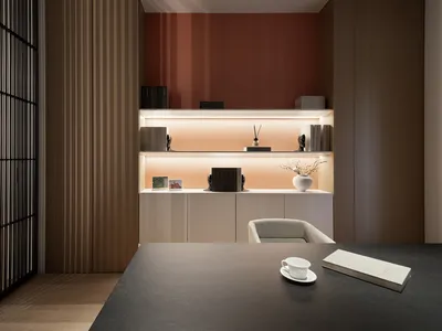 A modern minimalist home office with light-colored wood accents.