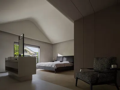 Modern minimalist bedroom featuring a black leather bed, wooden flooring, and a glass partition wall.