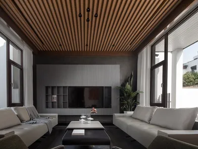 Modern industrial living room with metal accents and minimalist design.