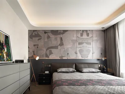 Modern bedroom with neutral tones and abstract wall design