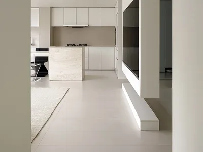 Modern kitchen with white marble island and white cabinets