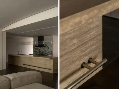 A close-up view of a modern kitchen countertop showcasing the texture and material of the stone.