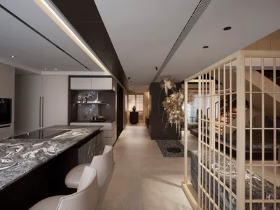 A modern kitchen interior featuring marble counters and flooring.